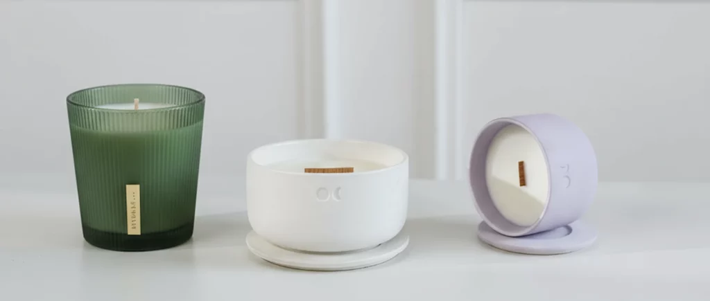 Combine these two candles images to one. Take rituals candle, and place it near Lumond candle. Do not change the candles, they should be the same as they are.